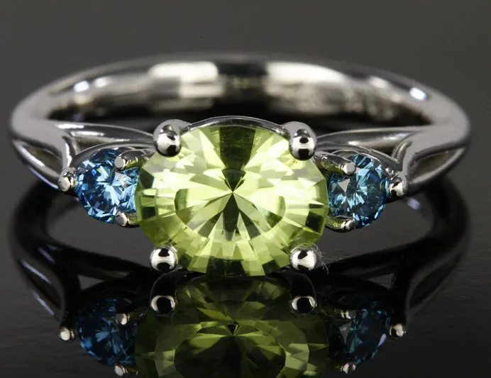 14K White Gold Oval Peridot and Enhanced Blue Diamond Ring