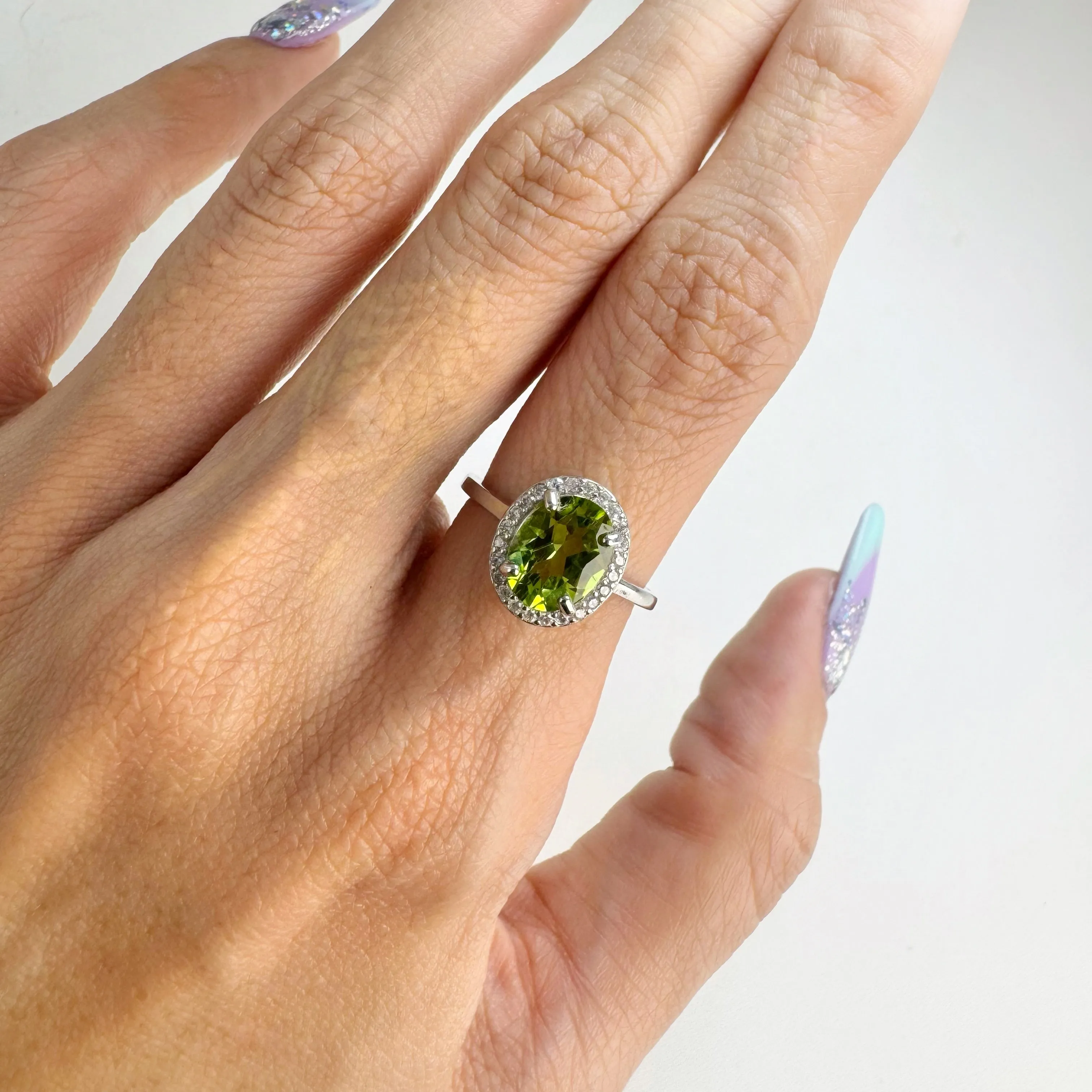 7 x 9 mm. Oval Cut Green Pakistani Peridot with Cz Halo Ring