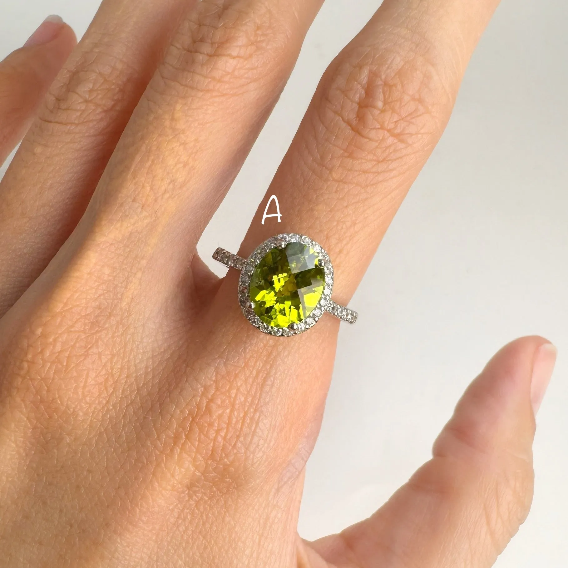 8 x 10  mm. Oval and Checkerboard Cut Green Pakistani Peridot with Cz Halo Ring