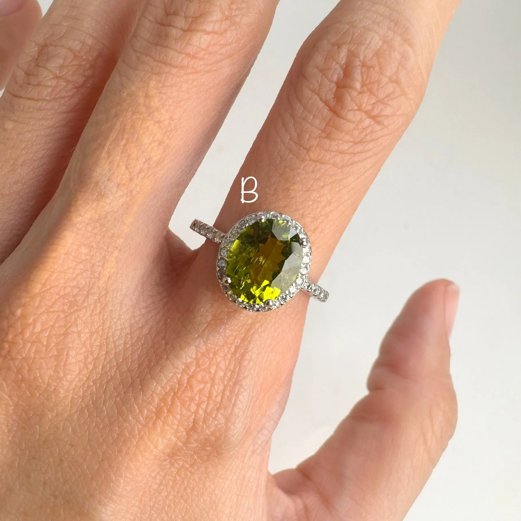 8 x 10  mm. Oval and Checkerboard Cut Green Pakistani Peridot with Cz Halo Ring