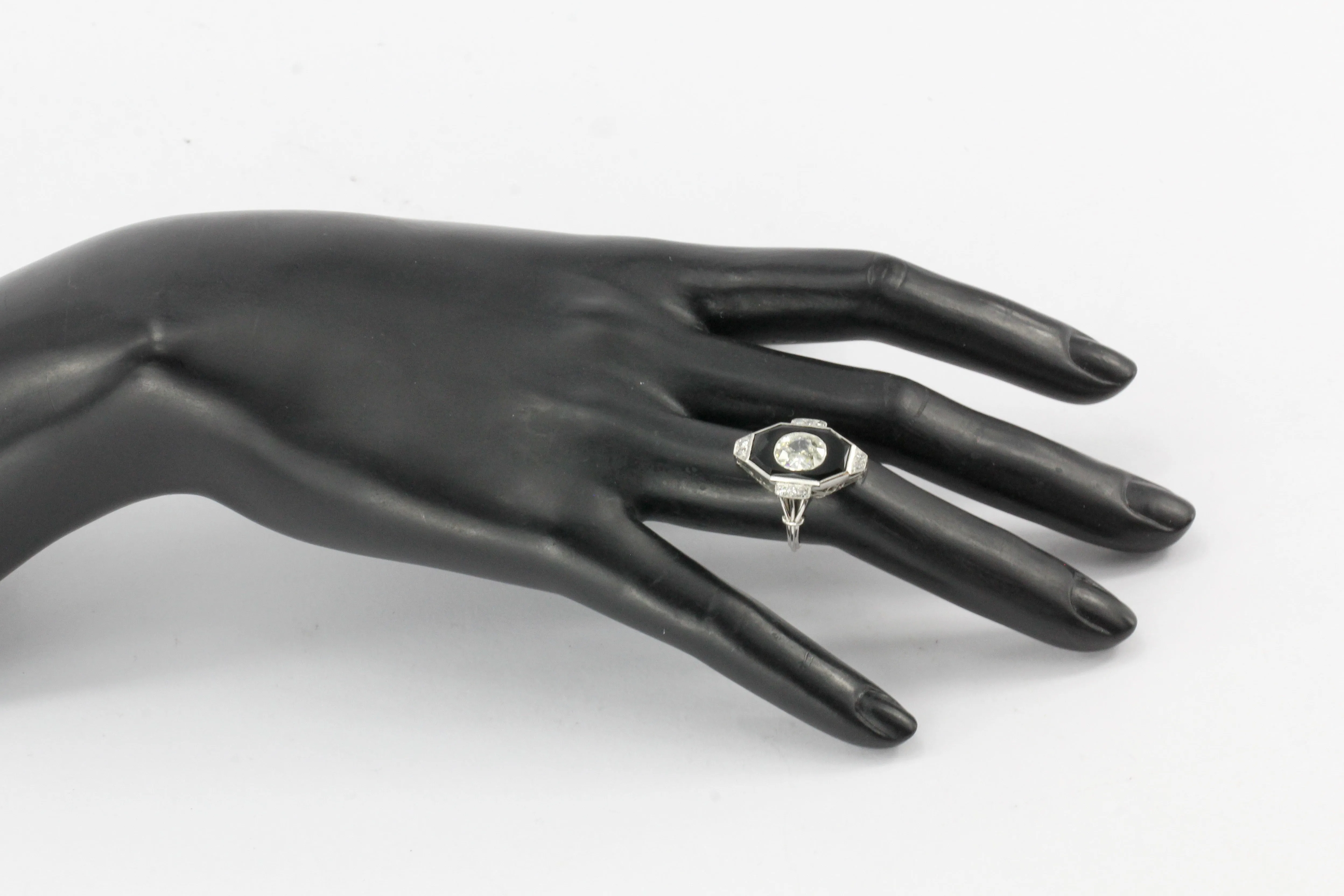 Art Deco Platinum Onyx and 1.3CT Oval Diamond Ring