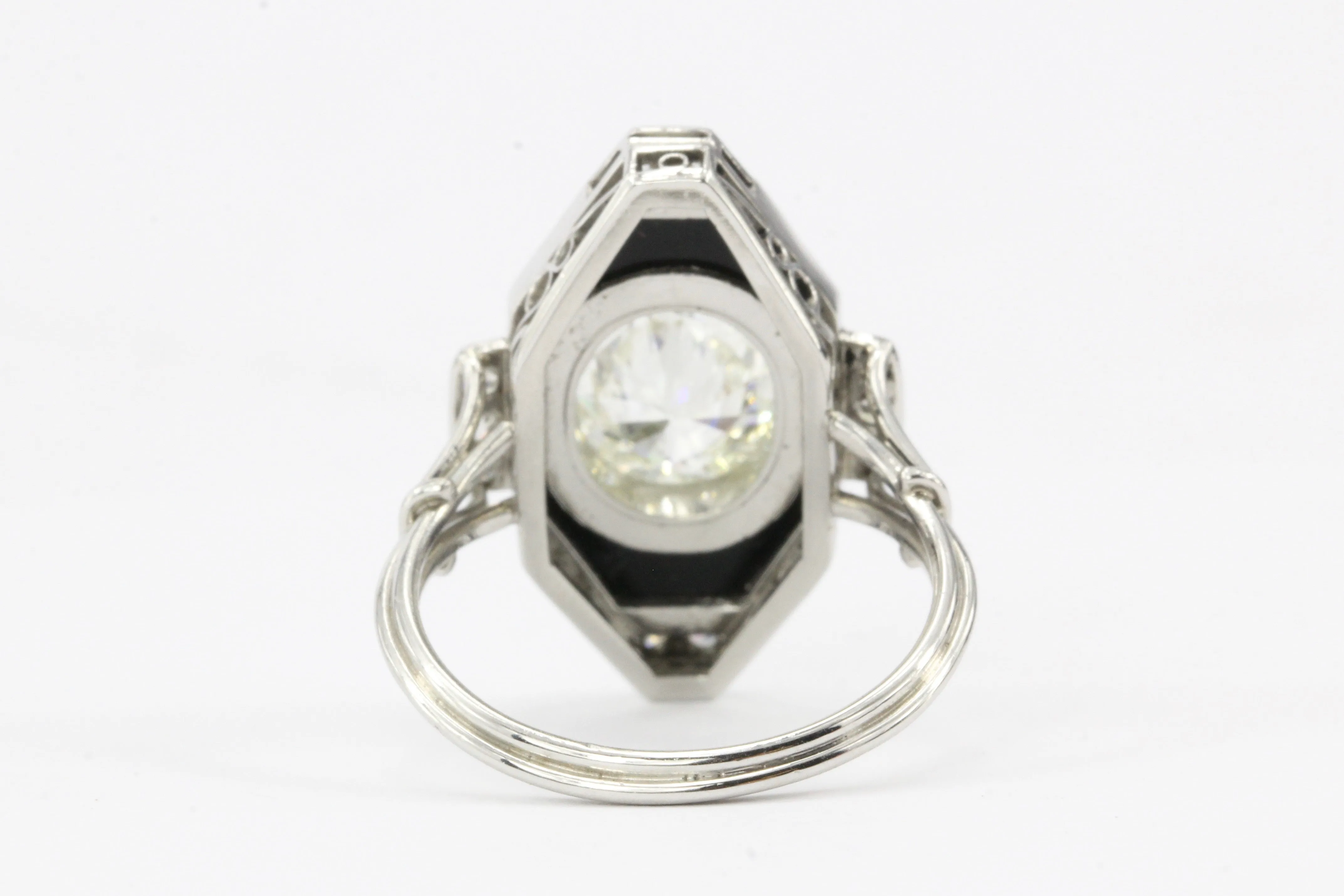 Art Deco Platinum Onyx and 1.3CT Oval Diamond Ring