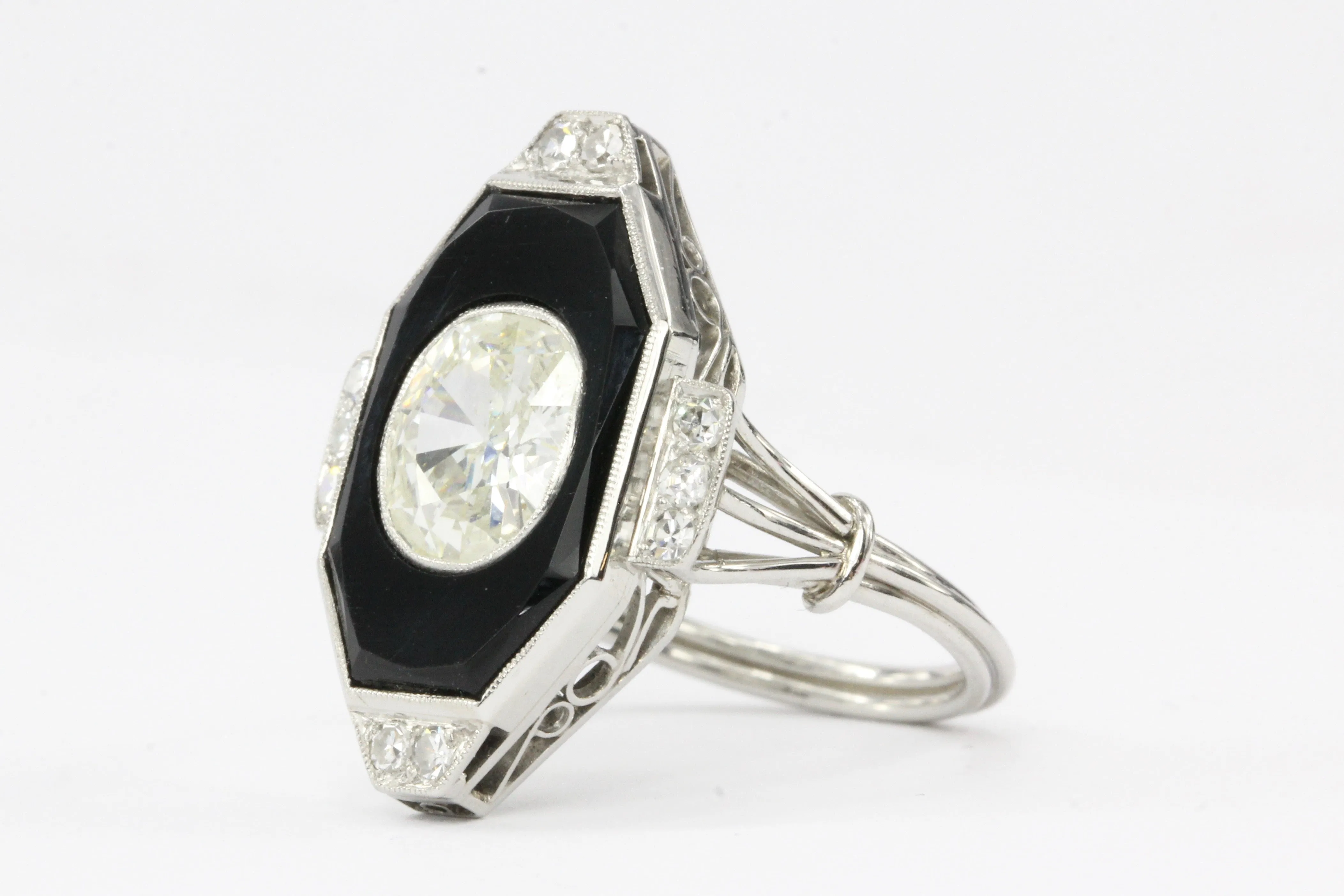 Art Deco Platinum Onyx and 1.3CT Oval Diamond Ring