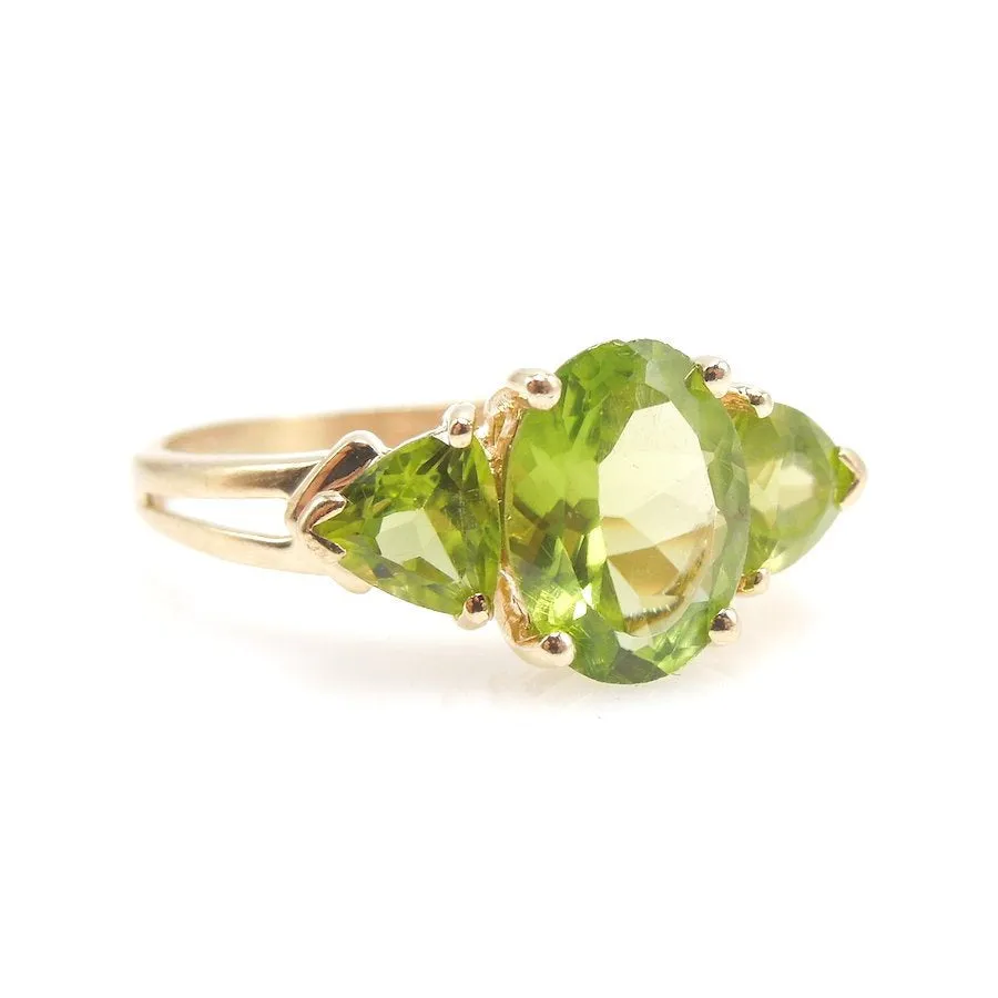 Three Stone Peridot Ring with Oval and Trillions in 14K Yellow Gold
