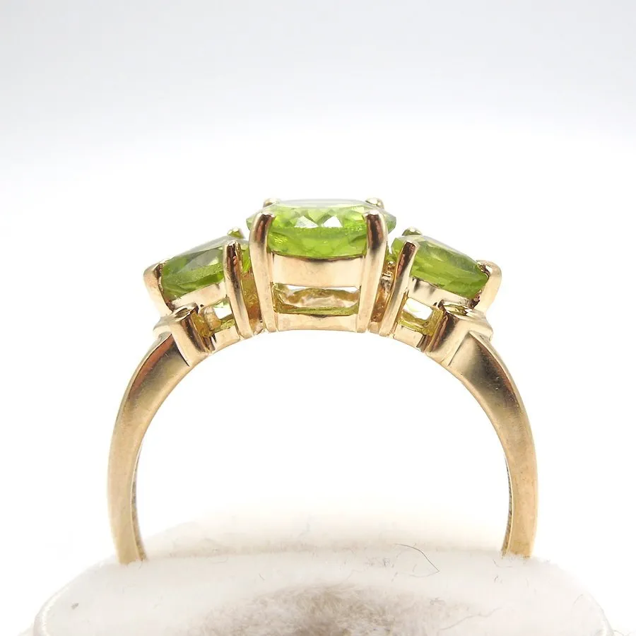 Three Stone Peridot Ring with Oval and Trillions in 14K Yellow Gold