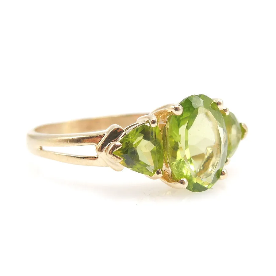 Three Stone Peridot Ring with Oval and Trillions in 14K Yellow Gold