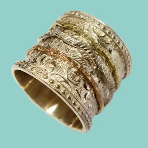 Womens floral Spinner Ring. Sterling Silver and Gold. Israeli Meditation rings.